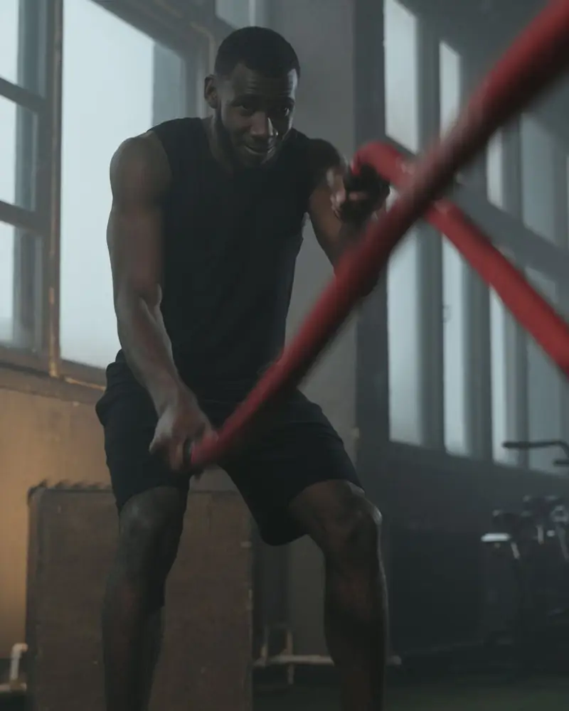 A man training with battle ropes