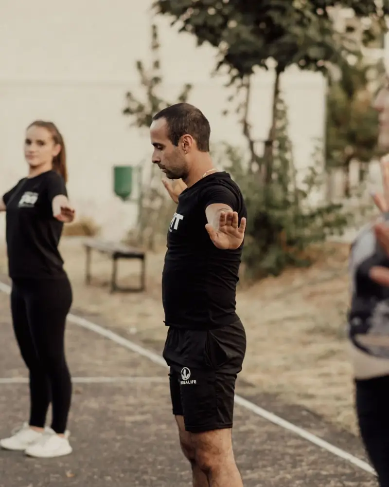 An outdoor group fitness training session in a park